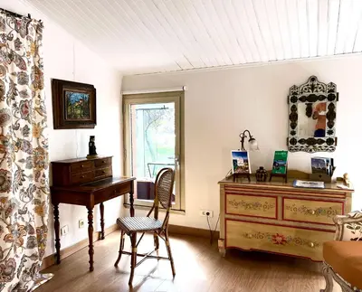 a room with a desk and a dresser and a window at Villa Melodie St Remy 6HA Piscine in Saint-Rémy-de-Provence