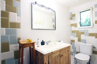 a bathroom with a sink and a toilet at Villa Melodie St Remy 6HA Piscine in Saint-Rémy-de-Provence