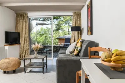 a living room with a couch and a table at Domaine du Val de Sault in Sault-de-Vaucluse