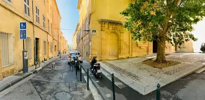 a group of motorcycles parked on a city street at Zola Studio fenêtre aveugle in Aix-en-Provence
