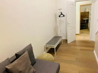 a living room with a couch and a table at Victoire Appartement in Aix-en-Provence