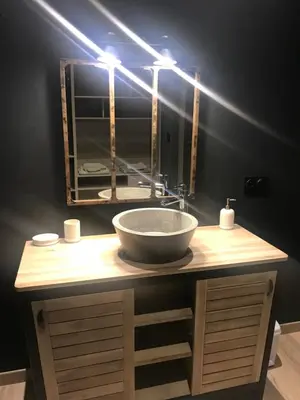 a bathroom with a sink and a mirror at Loft piscine et spa provence in LʼIsle-sur-la-Sorgue