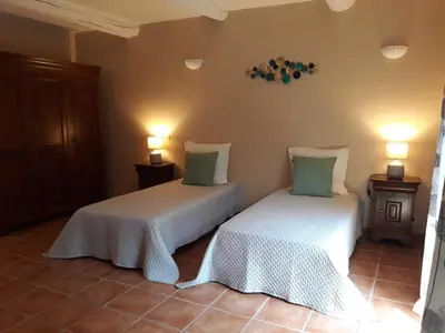 two beds sitting next to each other in a room at Le Mas des Vergers in Salon-de-Provence