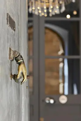 a door knob of a door with a squirrel on it at Maison Dauphine in Aix-en-Provence