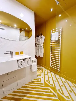 a bathroom with a sink and a mirror at Maison Dauphine in Aix-en-Provence