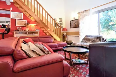a living room with a couch and a table at Villa envoûtante à Eyragues avec piscine in Eyragues
