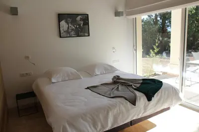 a bedroom with a bed with a scarf on it at Le Fournil en Provence in Caseneuve