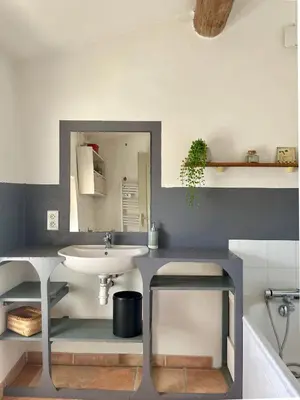 a bathroom with a sink and a mirror at 349 Les Maridats in Bédoin