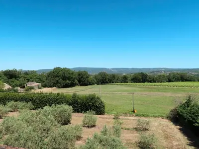 a view of a field with bushes and trees at Holiday Home Bastide du 19ième by Interhome in Oppède