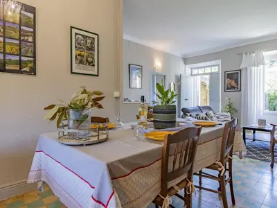 a dining room with a table and chairs at Holiday Home Bastide du 19ième by Interhome in Oppède
