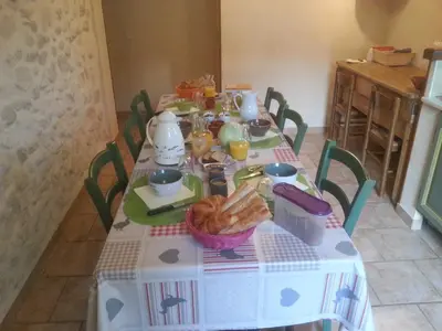 a table with a table cloth with food on it at Chambres d'Hôtes de Curnier in Bédoin