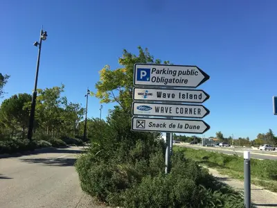 a street sign with several signs on a road at Villa in Crillon-le-Brave near Mont Ventoux in Crillon-le-Brave