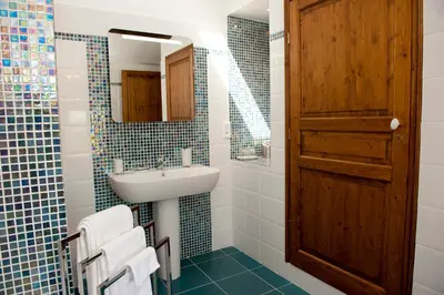 a bathroom with a sink and a mirror at La Maison du Peintre en Provence in Mallemort