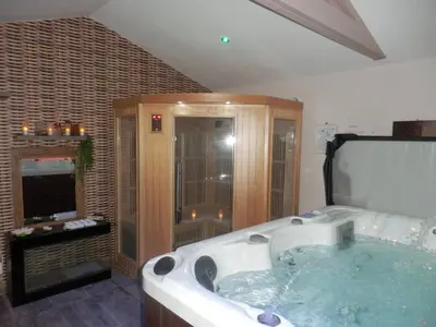 a large bathroom with a large tub in it at Suite luxe avec sauna et jacuzzi privée in Lambesc