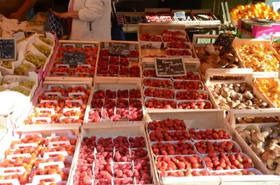 a display of strawberries in boxes in a market at Le Domaine Saint Jean in Saint-Saturnin-les-Apt
