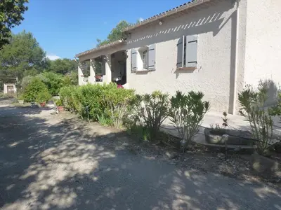 a house with a lot of plants in front of it at Chambre d'hôtes La Pinede in Lambesc