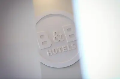 a close up of a bottle of baxter hotels logo at B&B HOTEL Aix en Provence Venelles in Venelles