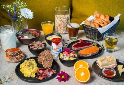 a table with a bunch of different types of breakfast foods at B&B HOTEL Aix en Provence Venelles in Venelles
