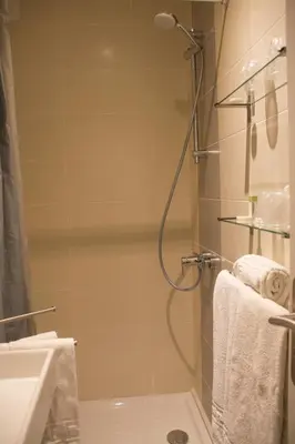 a bathroom with a shower and a sink at Le Concorde in Aix-en-Provence