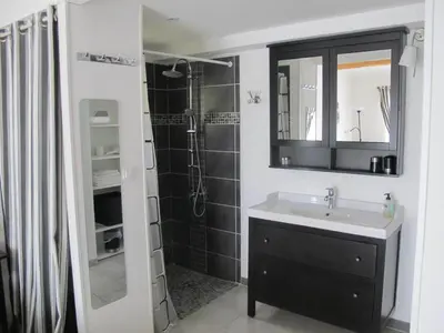 a bathroom with a sink and a shower at Lou Cardalines in Bédoin