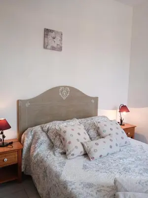 a bedroom with a bed with pillows on it at Les Gites du Mont Ventoux in Bédoin