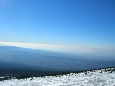 a view of the ocean from the top of a snow covered slope at Le Mas des Baux in Bédoin