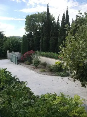 a bed with two towels sitting on top of it at Villa Neville in Châteaurenard