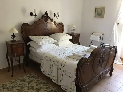 a bedroom with a bed with two towels on it at Villa Neville in Châteaurenard
