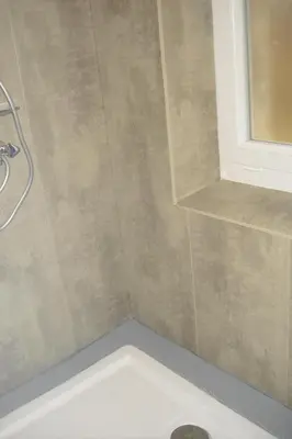 a bathroom with a shower with a toilet and a sink at Lou mas li Pitchoun 
