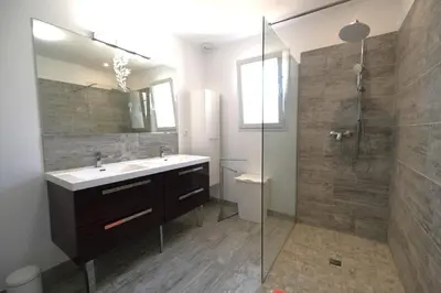 a bathroom with a sink and a shower at A pretty family house located in a tranquil area with a pretty view of the Luberon range. in Les Taillades