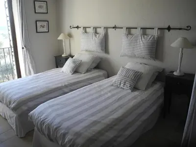 two beds sitting next to each other in a bedroom at OUSTAU DE PIERA in Gordes