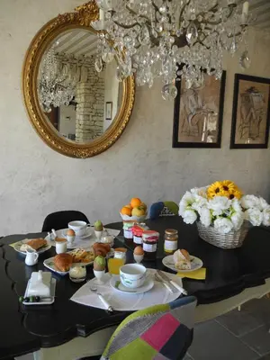 a table with food on it with a mirror at OUSTAU DE PIERA in Gordes