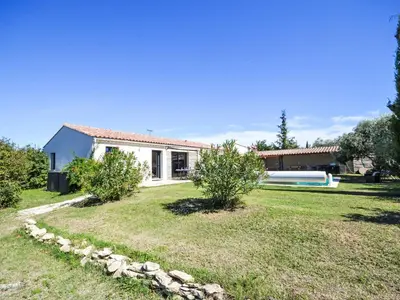 a house with a swimming pool in a yard at Holiday Home L'Oliveraie by Interhome in Saint-Didier
