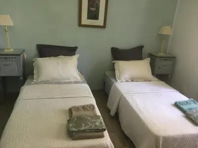 a room with two beds with a purse sitting on it at LA RESPELIDANE in Caromb