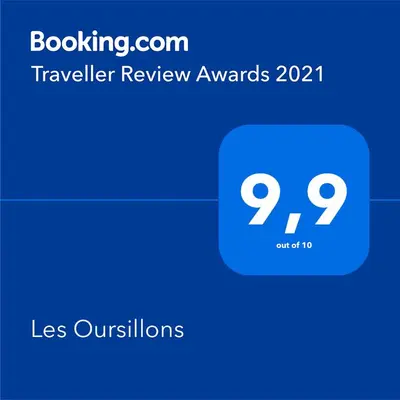 a screenshot of a phone with the travel review awards at Les Oursillons in Roussillon