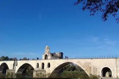 a bridge with people standing on top of it at La petite maison avec piscine face au Luberon in Robion en Luberon