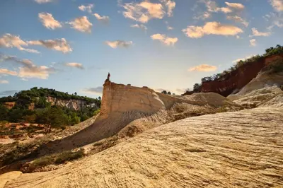 a view of a cliff with a church on top at Luxurious Provencal Village House, Walk to Village Pool in Rustrel
