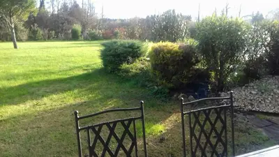 two park benches sitting in a field of grass at Pervenches in Jonquerettes
