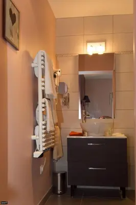 a bathroom with a sink and a mirror and a sink at La Bastide de Venelles in Venelles