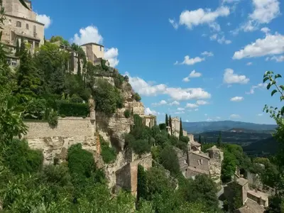 a view of a mountain with houses on it at Ménerbes Home with Private Pool in Ménerbes