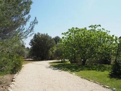 a gravel road with trees on either side at Premium villa with garden and pool, Lambesc in Lambesc