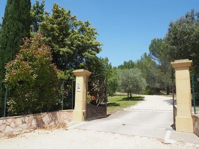 a gate to a driveway with a fence at Premium villa with garden and pool, Lambesc in Lambesc