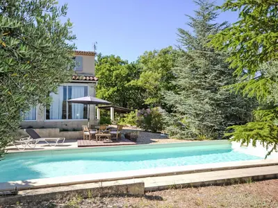 a swimming pool in the backyard of a house at Holiday Home Les Iris by Interhome in Gargas