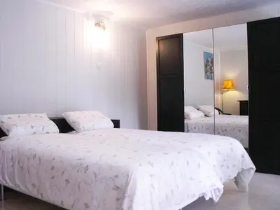 a bedroom with two beds and a large mirror at Apartment Haider by Interhome in Caumont-sur-Durance