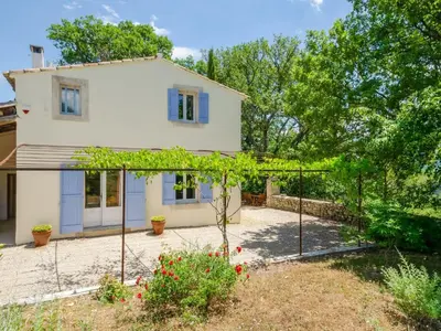 a house with a garden and a fence at Holiday Home Les Cotes by Interhome in Saint-Martin-de-Castillon
