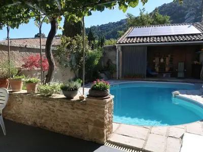 a swimming pool in a yard with a house at Holiday Home La Croix du Puits by Interhome in Robion en Luberon