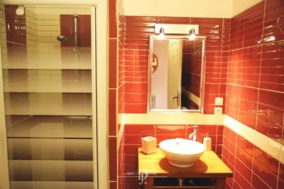 a bathroom with a sink and a mirror at Mas de la Sauline in La Roque-dʼAnthéron