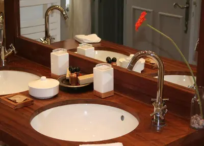 a bathroom counter with a sink and a mirror at Le Couvent in Apt