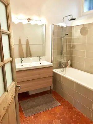 a bathroom with a sink and a tub and a shower at la bonbonniere - Townhouse Saint-Saturnin-lès-Apt in Saint-Saturnin-les-Apt