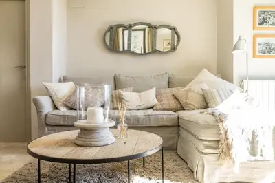 a living room with a couch and a table at Maison Ventoux in Crillon-le-Brave